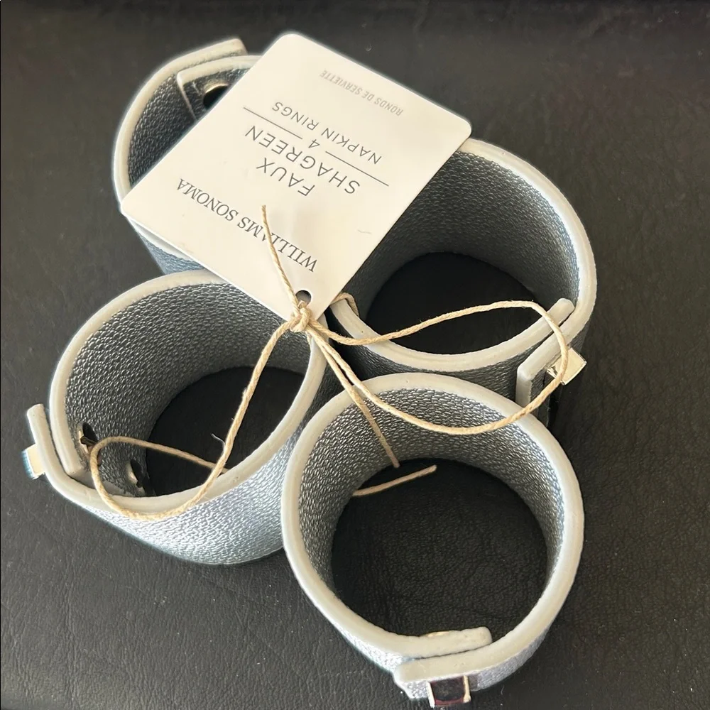 Williams Sonoma set of 12 Faux Shagreen Napkin Rings in Silver.